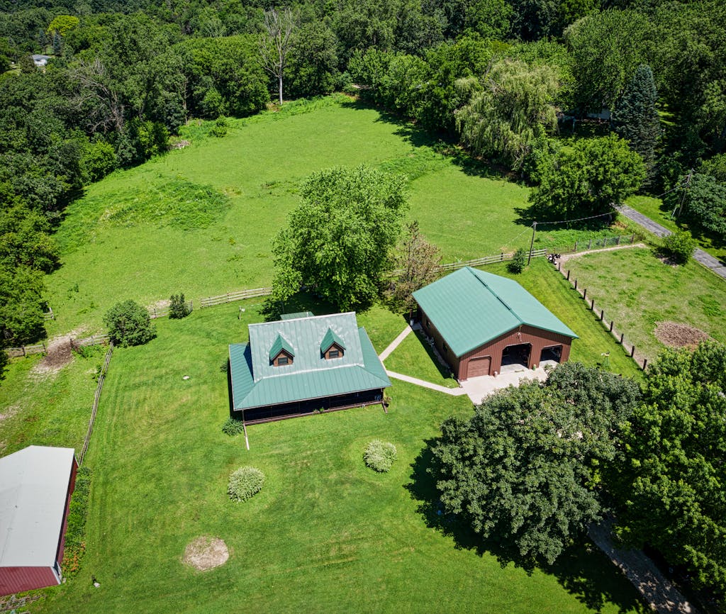 Aerial view of a countryside home in Dakota, Minnesota during summer.